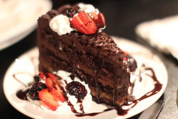 Chocolate Cake with fresh fruit and whipped cream.